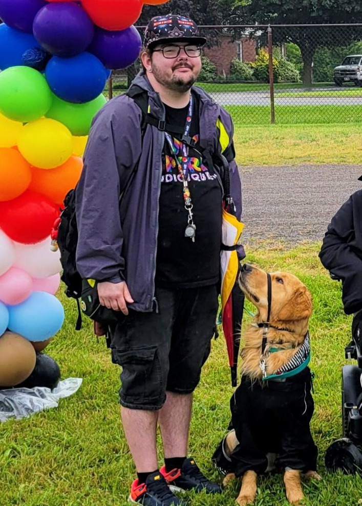 Photo of Noah and his service dog Cedar